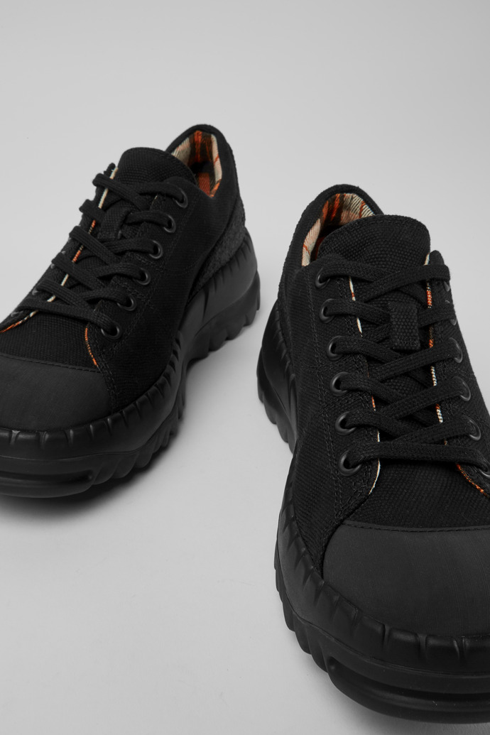 Close-up view of Teix Black rubber and BCI cotton shoes