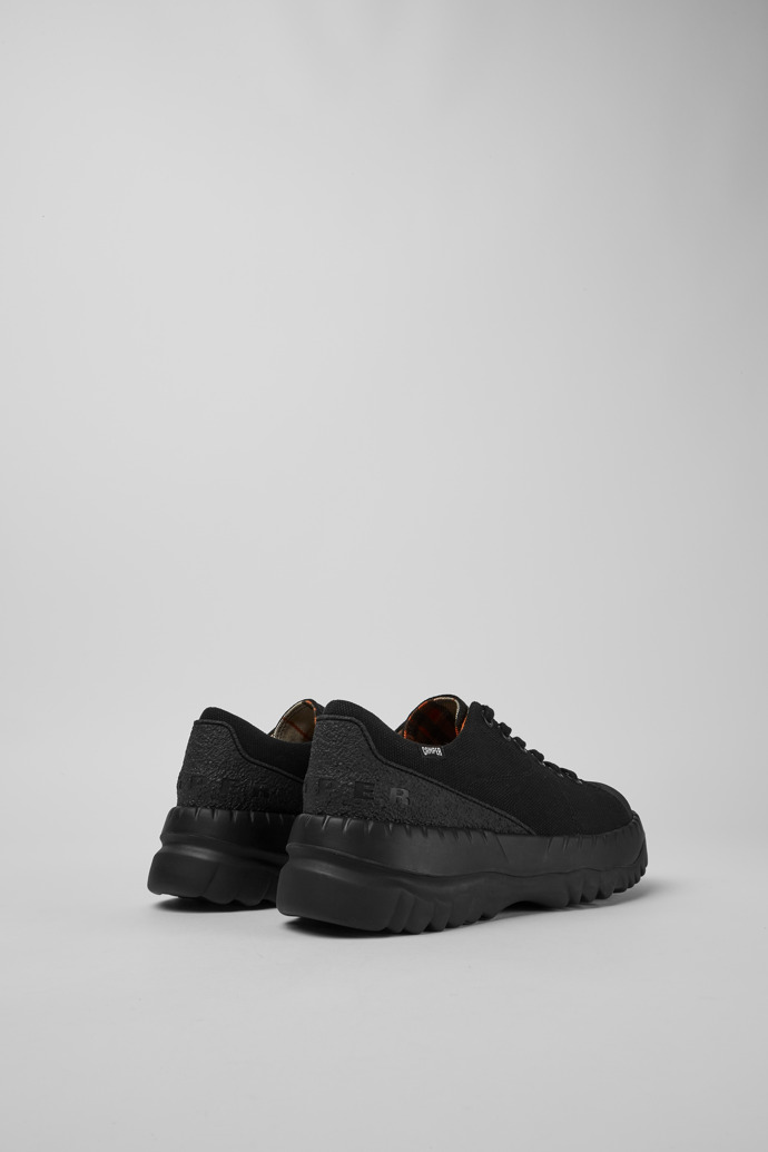 Back view of Teix Black rubber and BCI cotton shoes