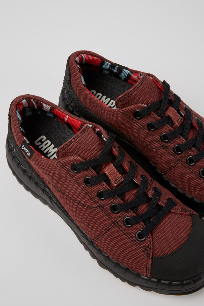 Close-up view of Teix Burgundy rubber and BCI cotton shoes