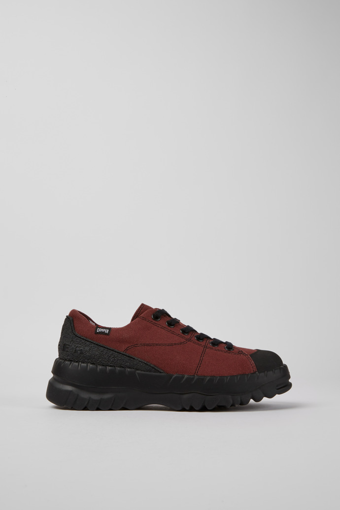 Side view of Teix Burgundy rubber and BCI cotton shoes