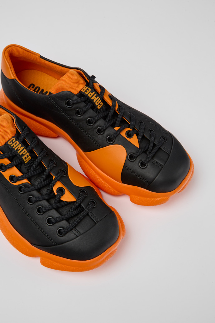 Close-up view of Karst Black and orange leather shoes for women