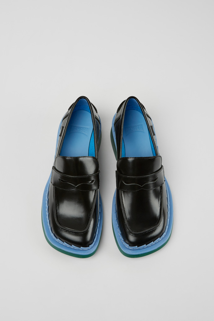 Overhead view of Taylor Black, blue, and green leather loafers for women