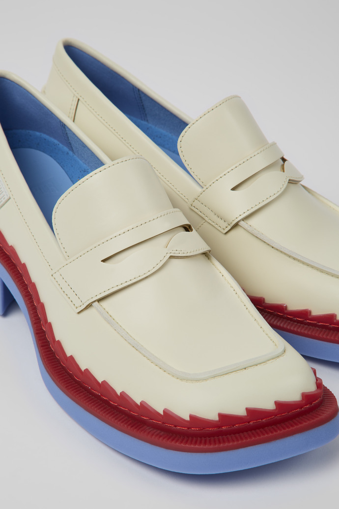 Close-up view of Taylor White and red leather loafers for women