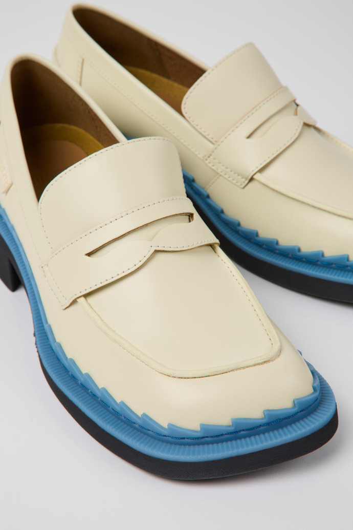 Close-up view of Taylor White and blue leather loafers for women
