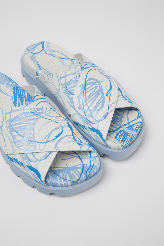Close-up view of Brutus Sandal White and blue printed leather sandals for women