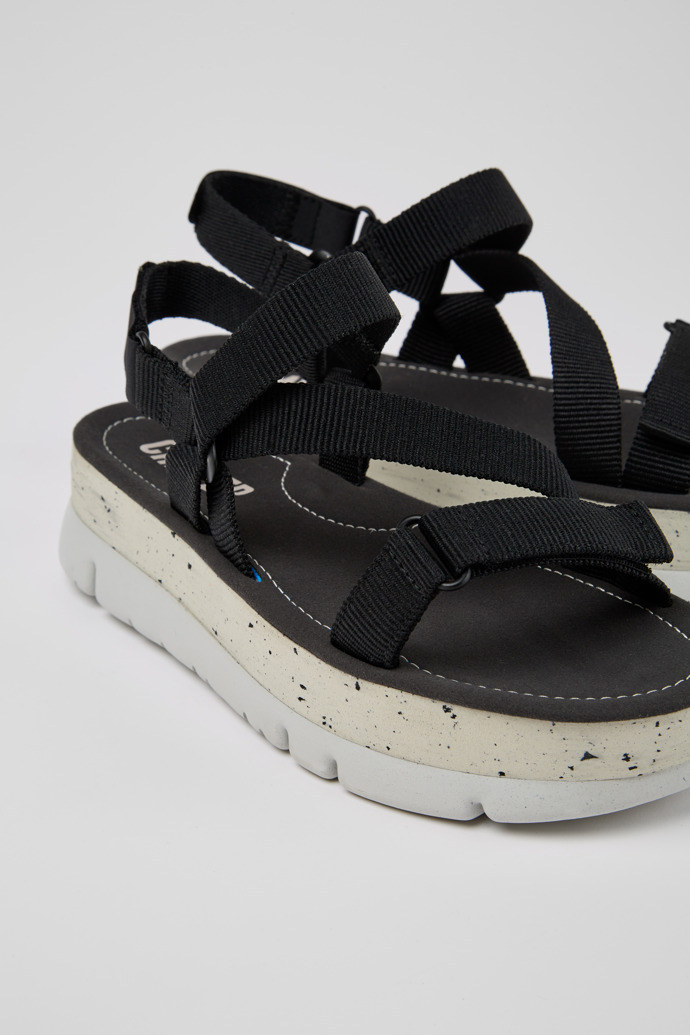 Close-up view of Oruga Up Black recycled PET sandals for women