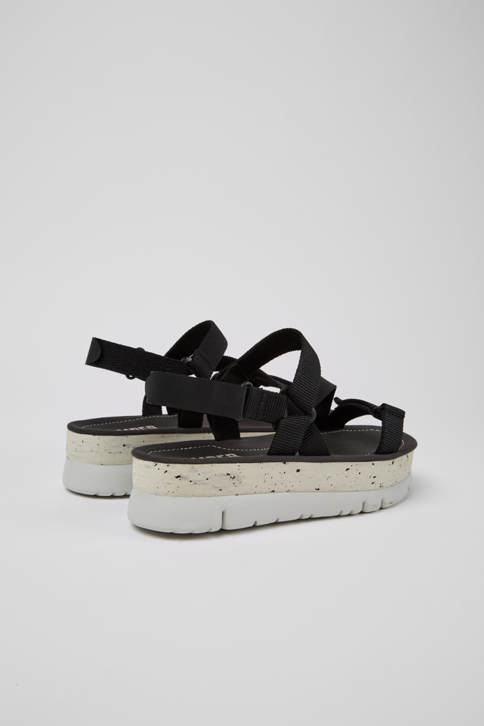 Back view of Oruga Up Black recycled PET sandals for women