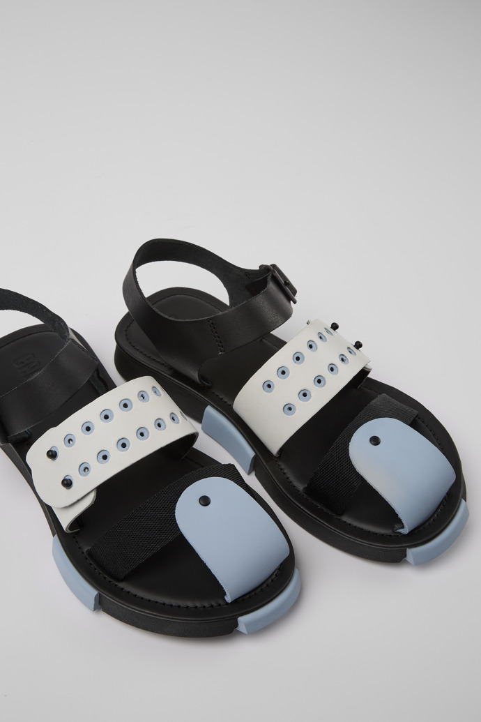 Close-up view of Set Black and white leather sandals for women