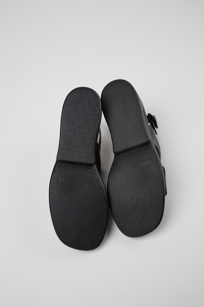 The soles of Kaah Black Leather 2-Strap Sandal for Women