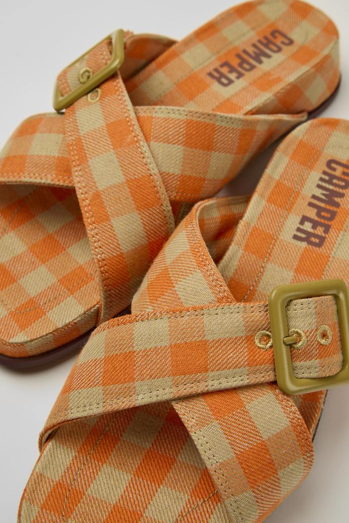 Close-up view of Atonik Orange and beige sandals for women