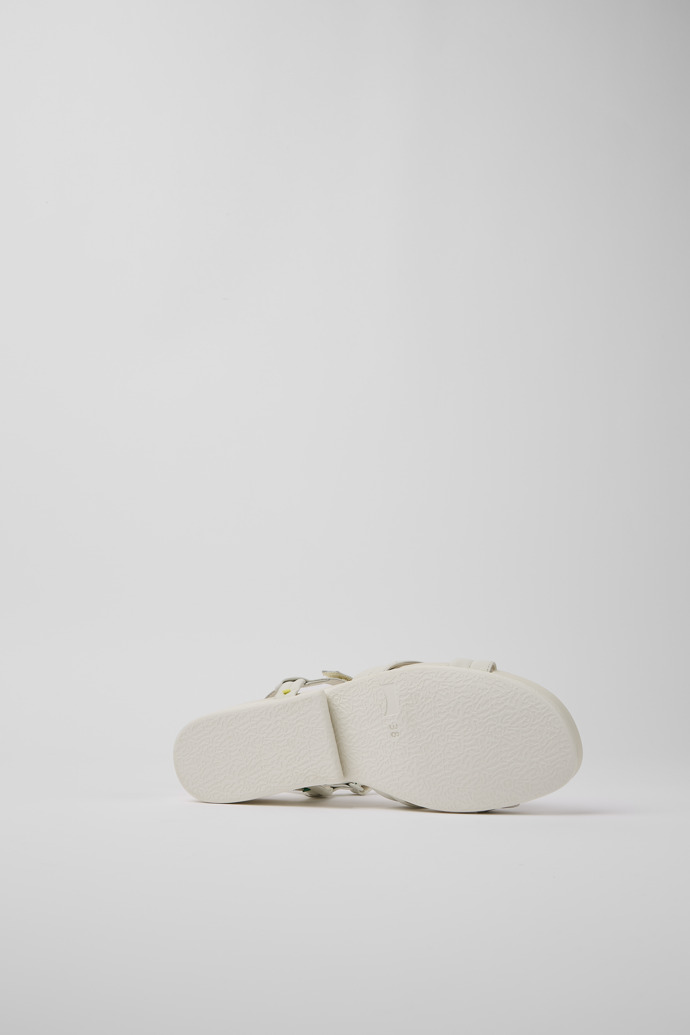 The soles of Minikaah White leather sandals for women