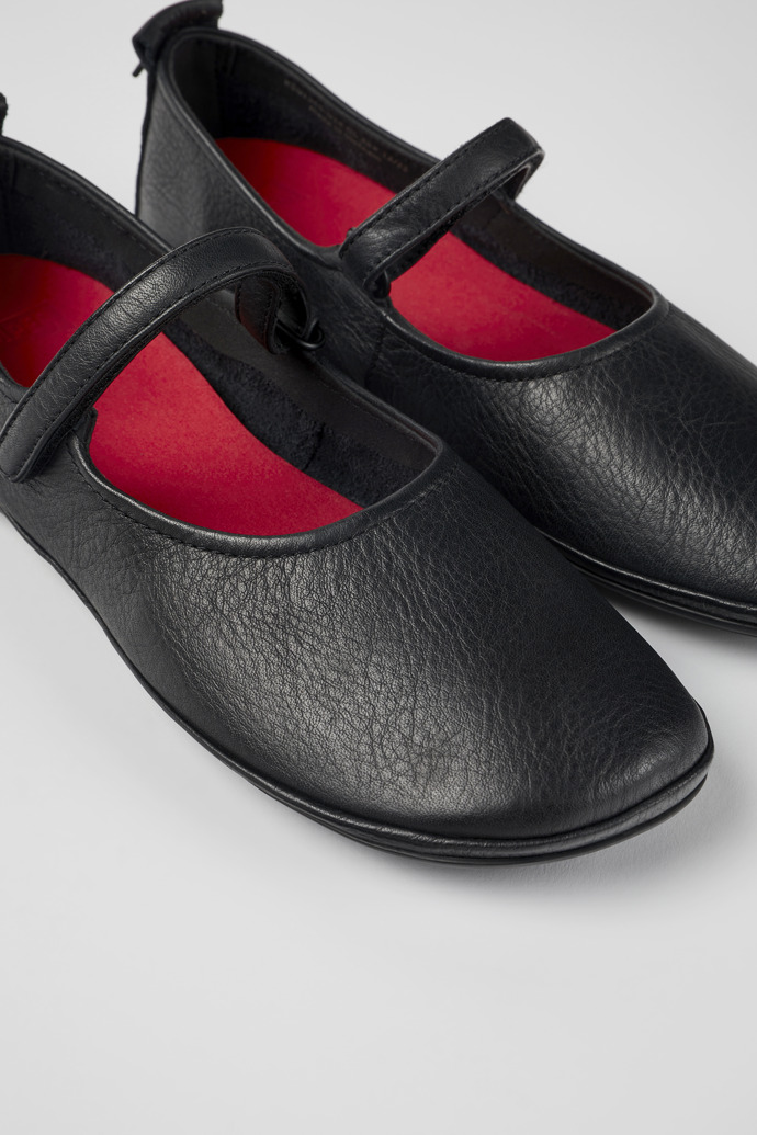 Close-up view of Right Black leather ballerinas for women