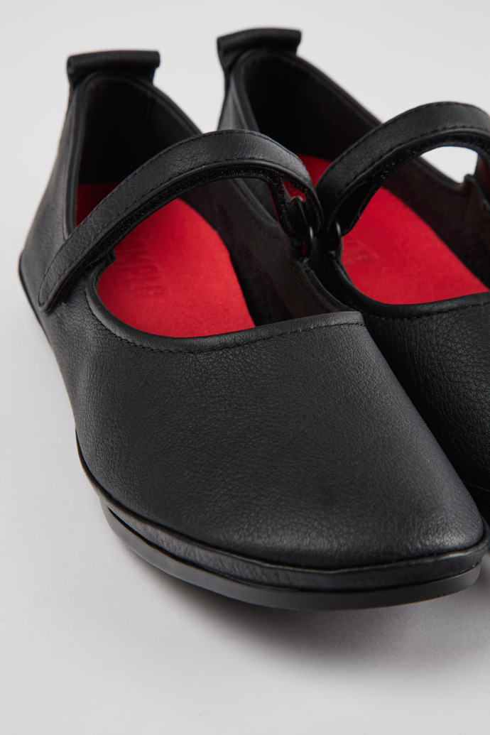 Close-up view of Right Black Leather Women's Shoes.