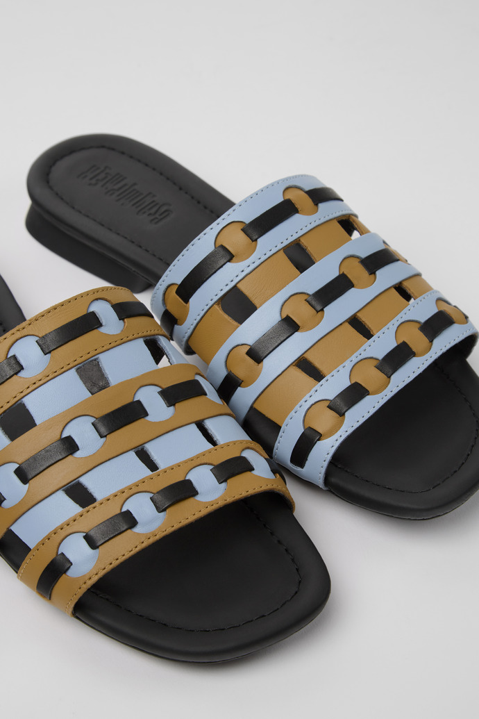 Close-up view of Twins Brown, blue, and black leather sandals for women