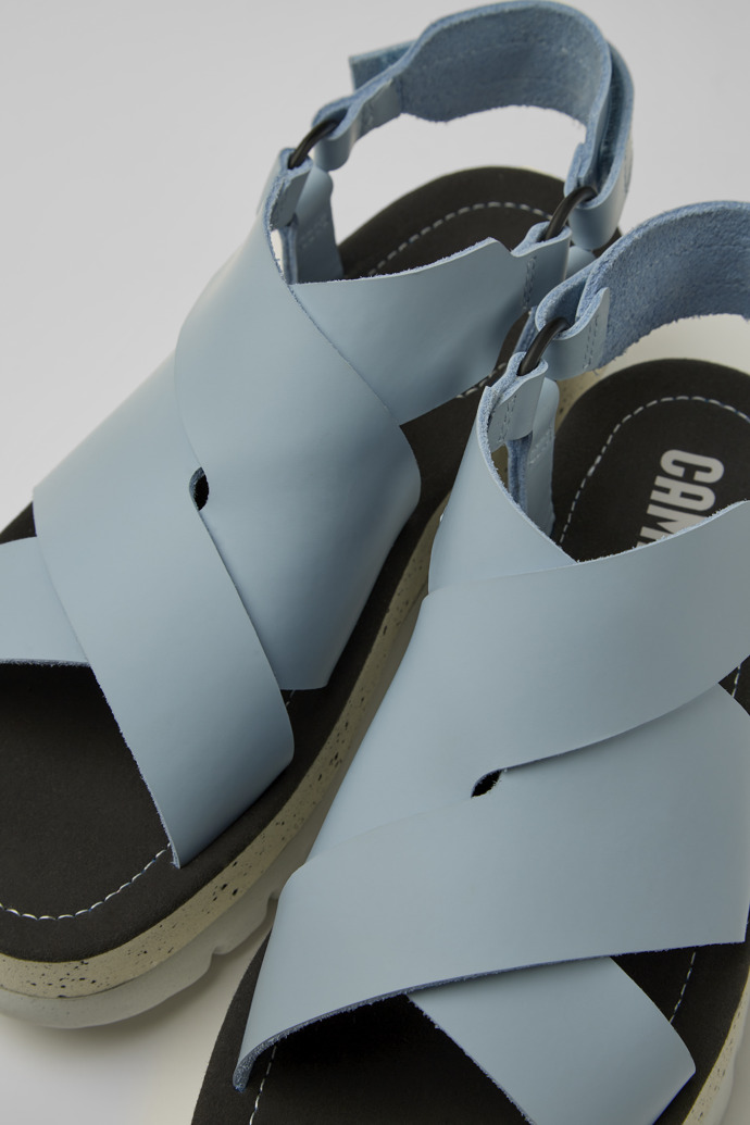 Close-up view of Oruga Up Blue leather sandals for women