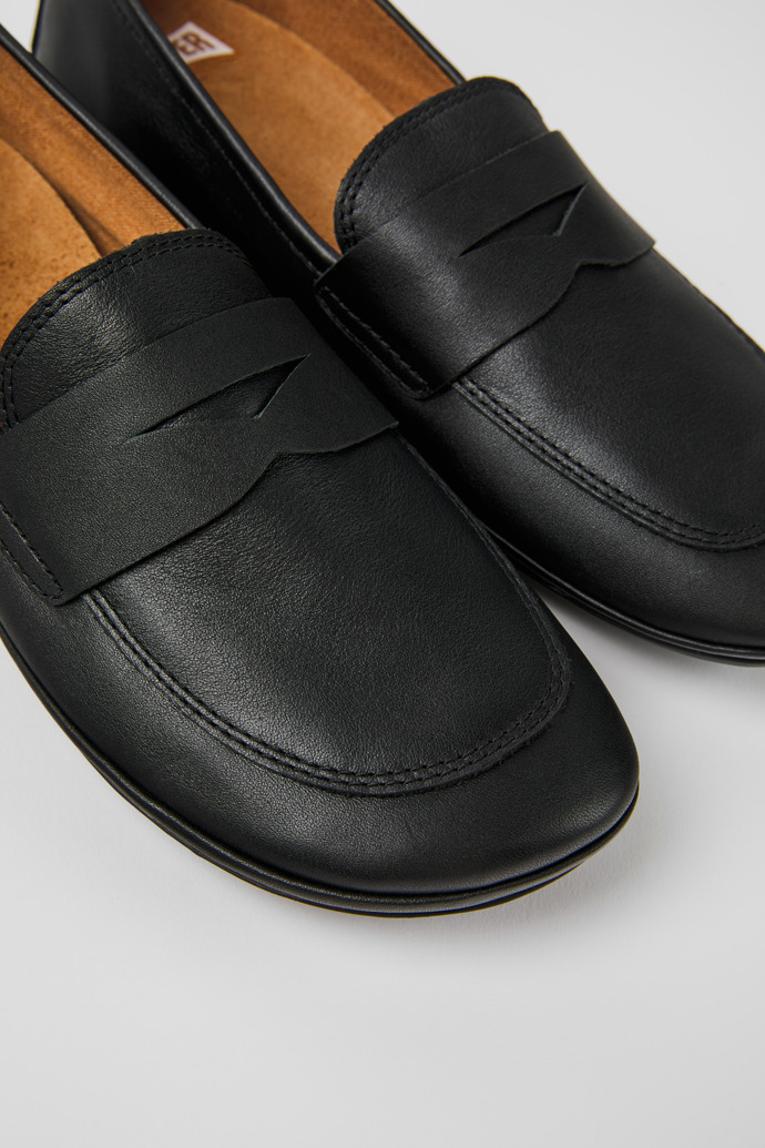 Close-up view of Right Black leather shoes for women