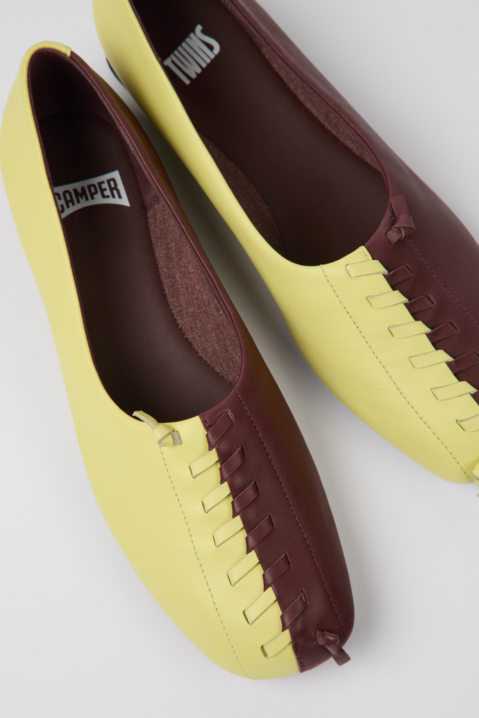 Close-up view of Twins Yellow and burgundy ballerina flats for women