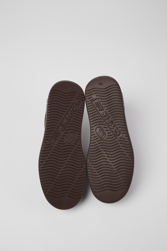The soles of Runner K21 Burgundy nubuck sneakers for women
