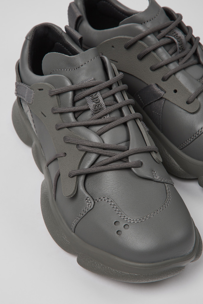 Close-up view of Karst Gray leather and textile sneakers for women