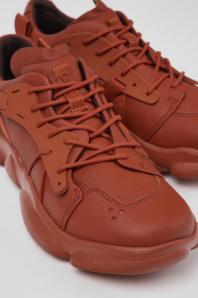 Close-up view of Karst Red leather and textile sneakers for women