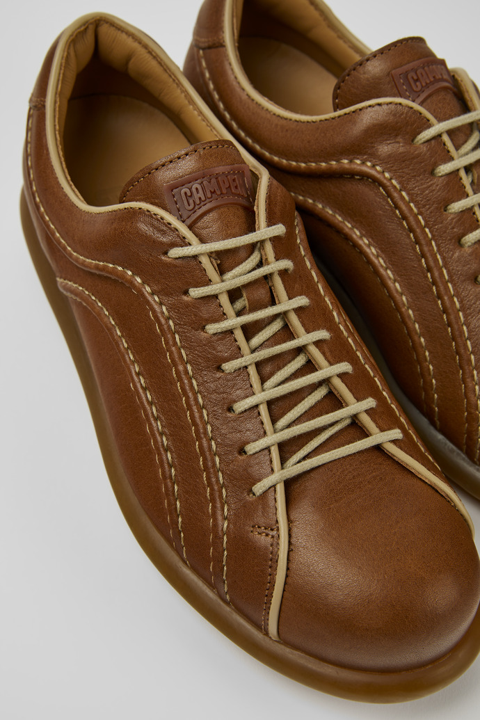 Close-up view of Pelotas Brown leather sneakers for women