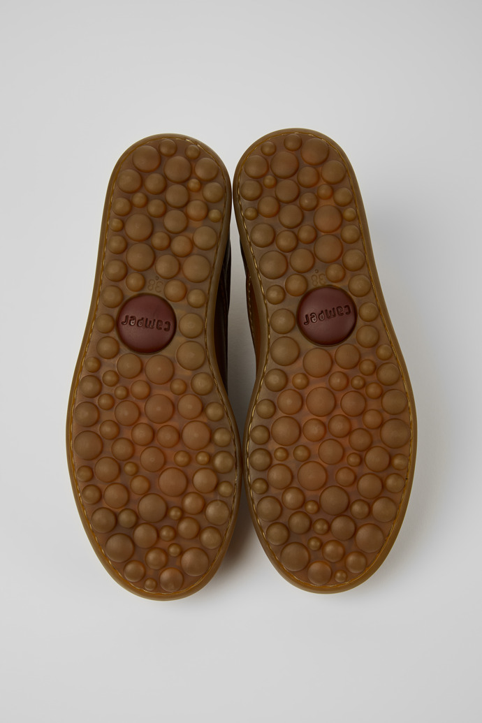 The soles of Pelotas Brown leather sneakers for women
