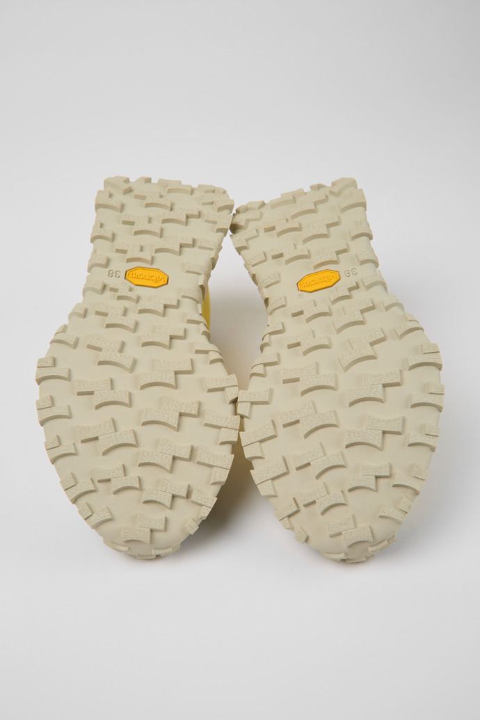 The soles of Drift Trail Yellow textile and nubuck sneakers for women