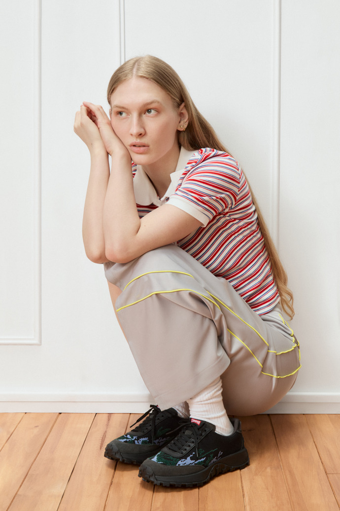 A model wearing Twins Multicolor Recycled PET and Leather Sneakers for Women.