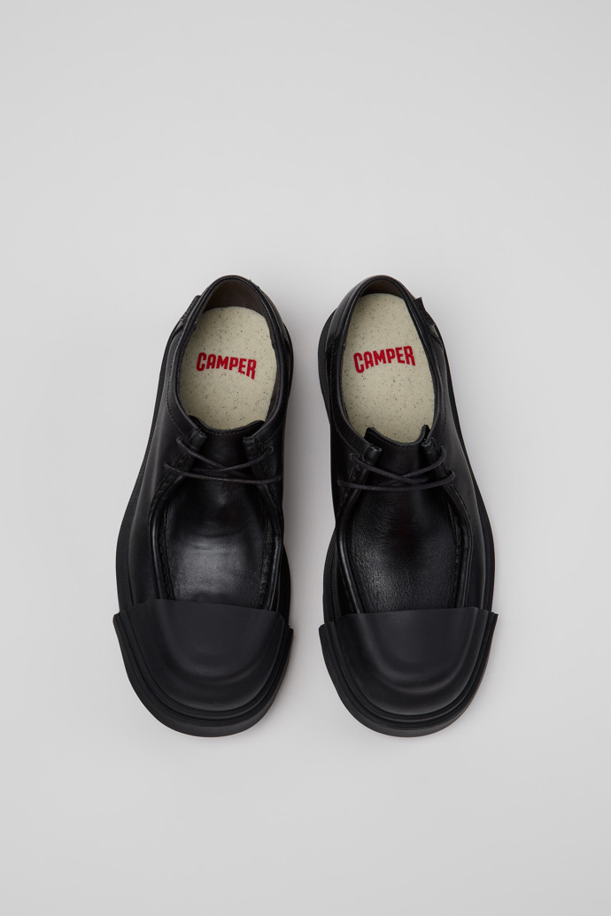 Overhead view of Junction Black Leather Shoes for Women.