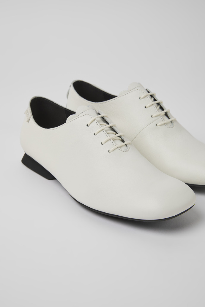 Close-up view of Casi Myra White leather shoes for women