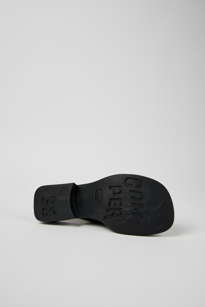 The soles of Dana Black Leather 2-Strap Sandal for Women
