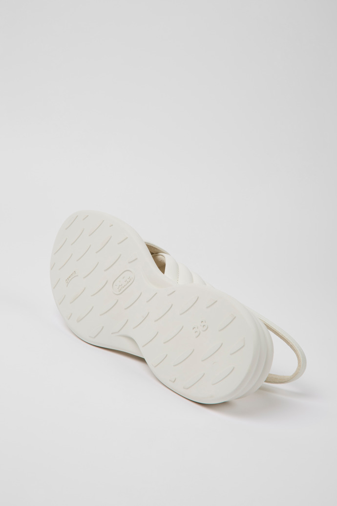 The soles of Spiro White leather sandals for women