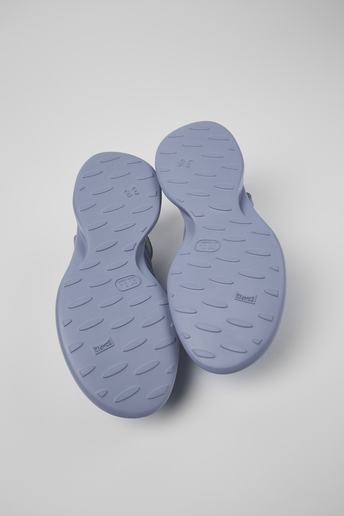The soles of Spiro Blue Leather Cross-strap Sandal for Women