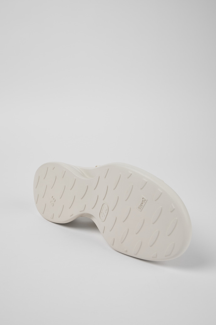 The soles of Spiro White Leather Cross-strap Sandal for Women