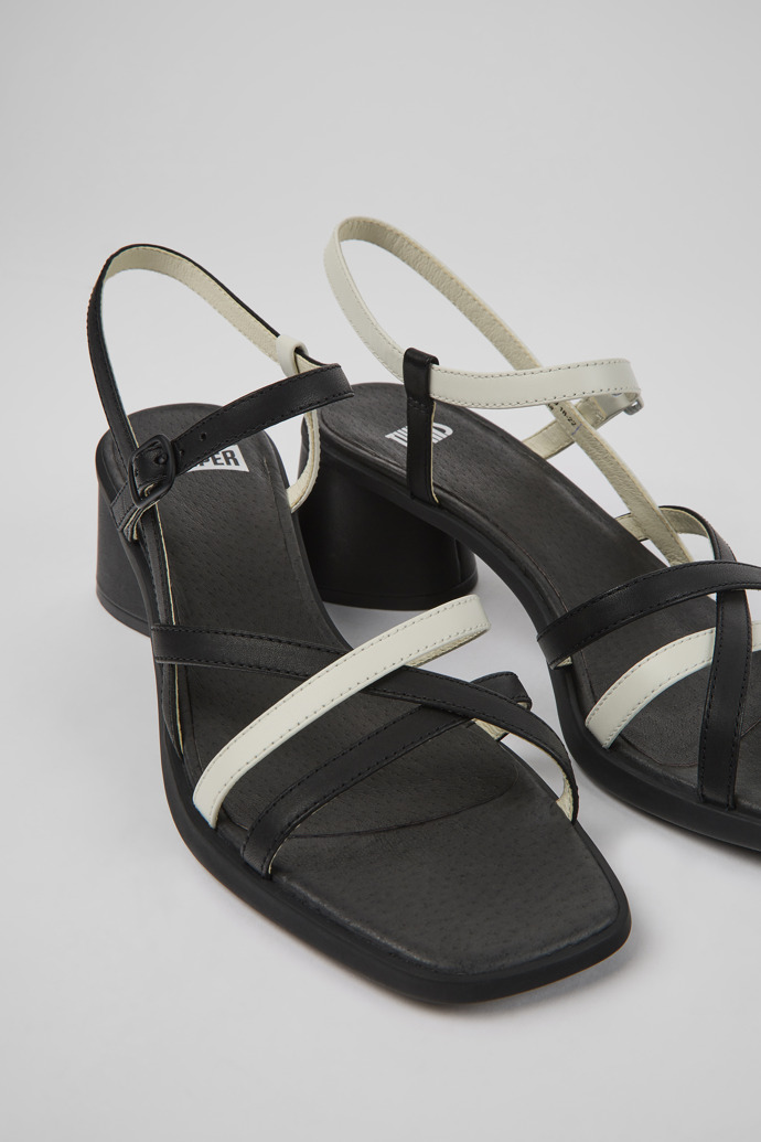 Close-up view of Twins Black and white leather sandals for women
