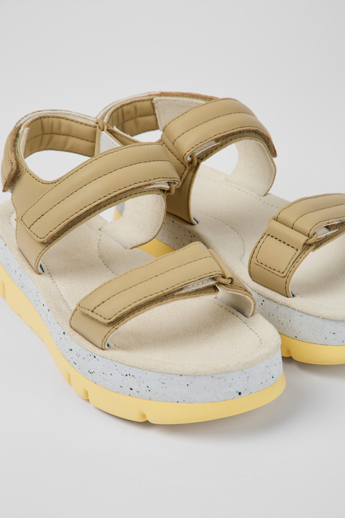 Close-up view of Oruga Up Beige leather sandals for women