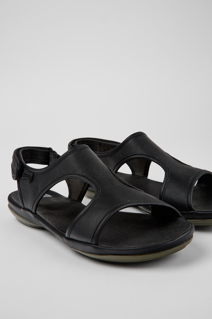 Close-up view of Right Black leather sandals for women