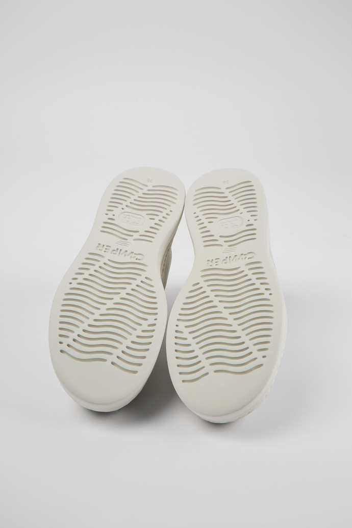 The soles of Runner Up White non-dyed leather sneakers for women