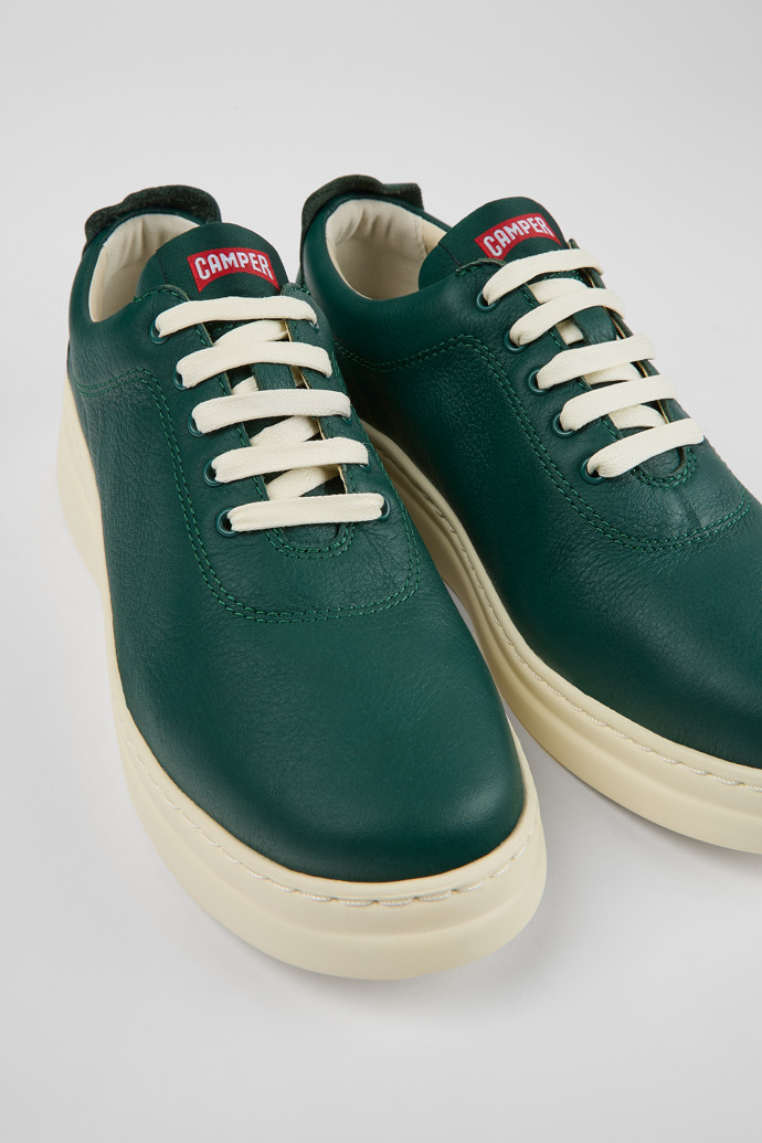 Close-up view of Runner Up Green leather sneakers for women