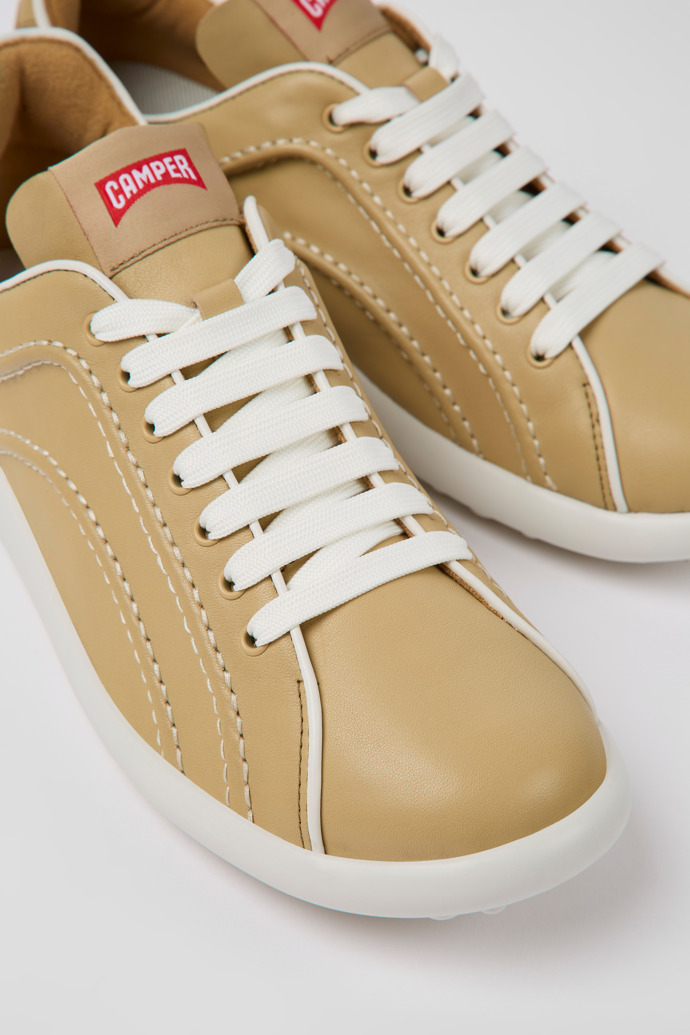 Close-up view of Pelotas XLite Beige leather sneakers for women