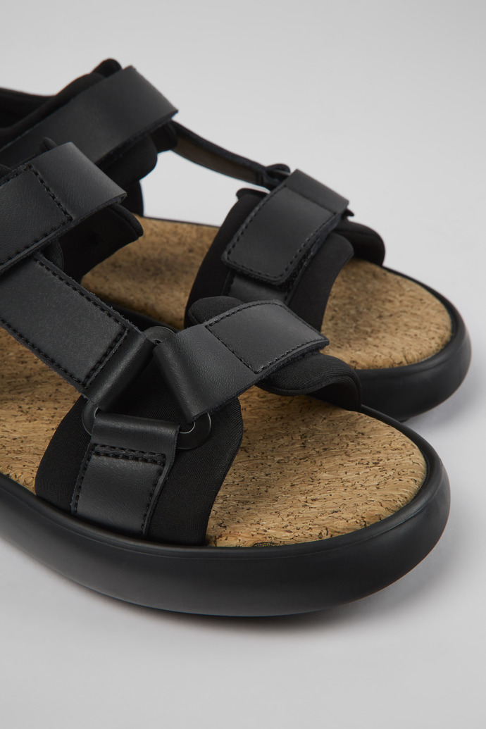 Close-up view of Pelotas Flota Black leather and textile sandals for women