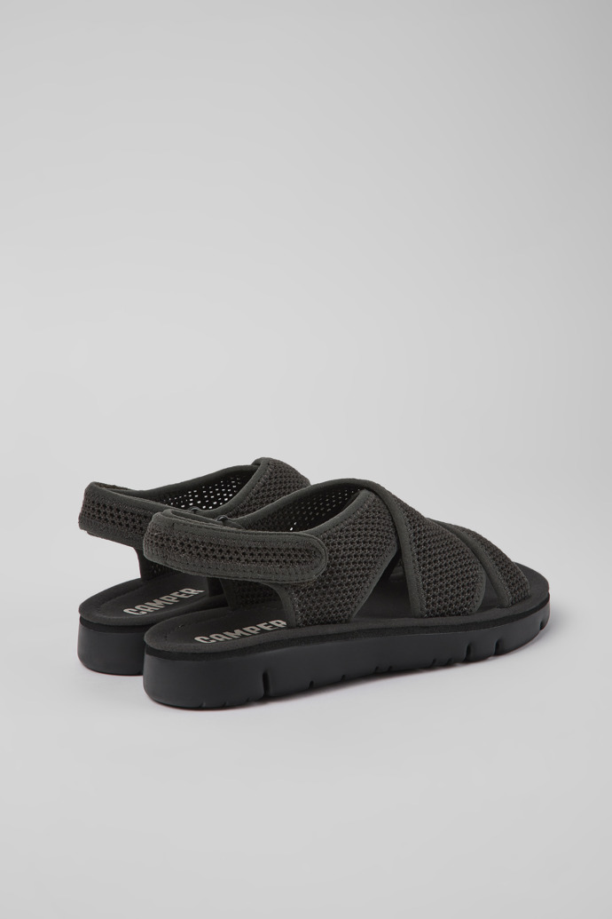 Back view of Oruga Dark gray textile sandals for women