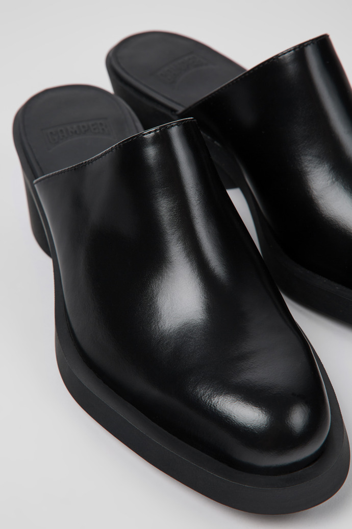 Close-up view of Bonnie Black leather mules for women