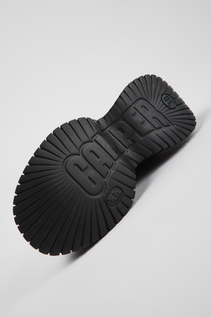 The soles of BCN Black leather shoes for women