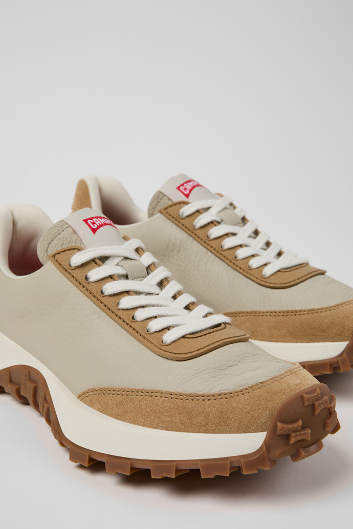Close-up view of Drift Trail Beige Leather and Nubuck Sneakers for Women.