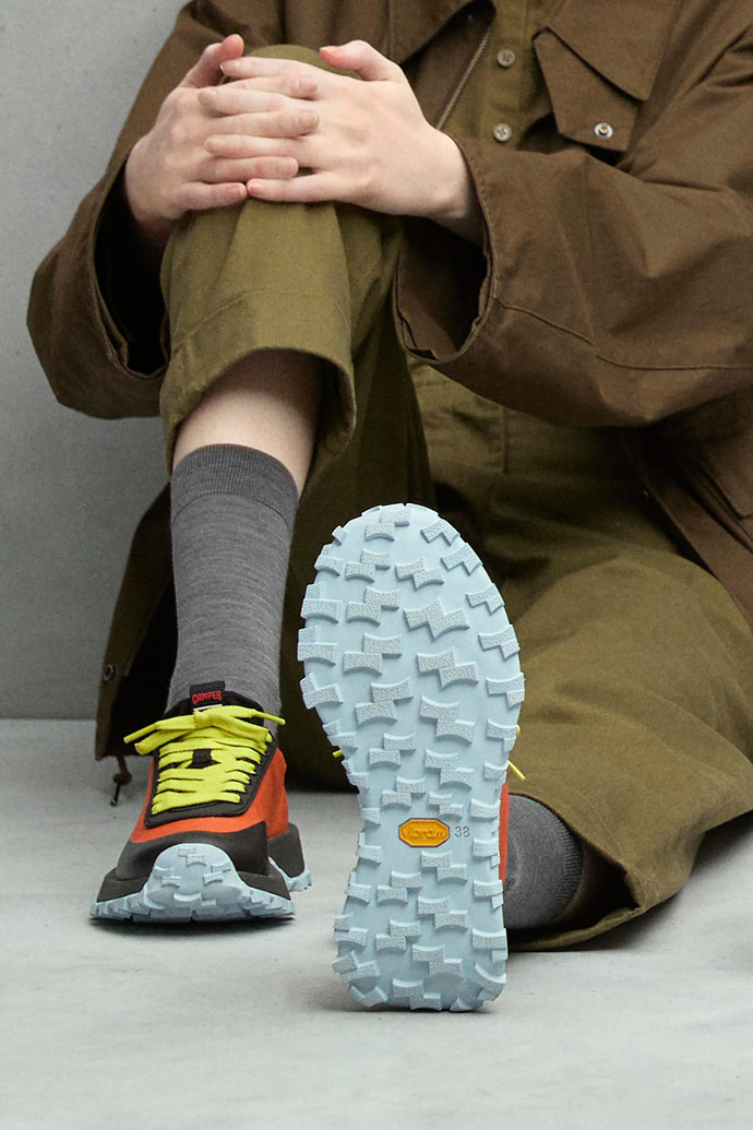 A model wearing Drift Trail VIBRAM Multicolor textile sneakers for women