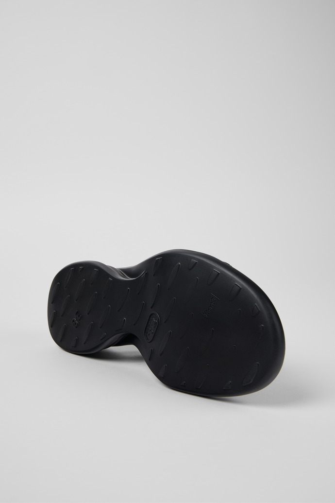 The soles of Spiro Black Leather 2-Strap Sandal for Women