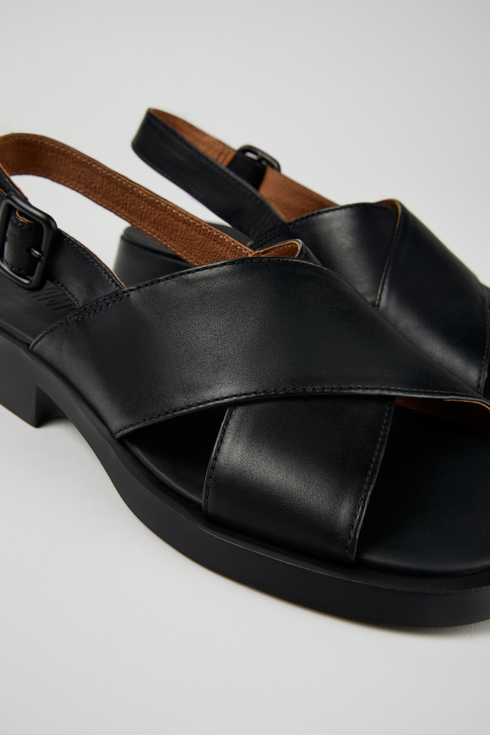 Close-up view of Dana Black Leather Cross-strap Sandal for Women