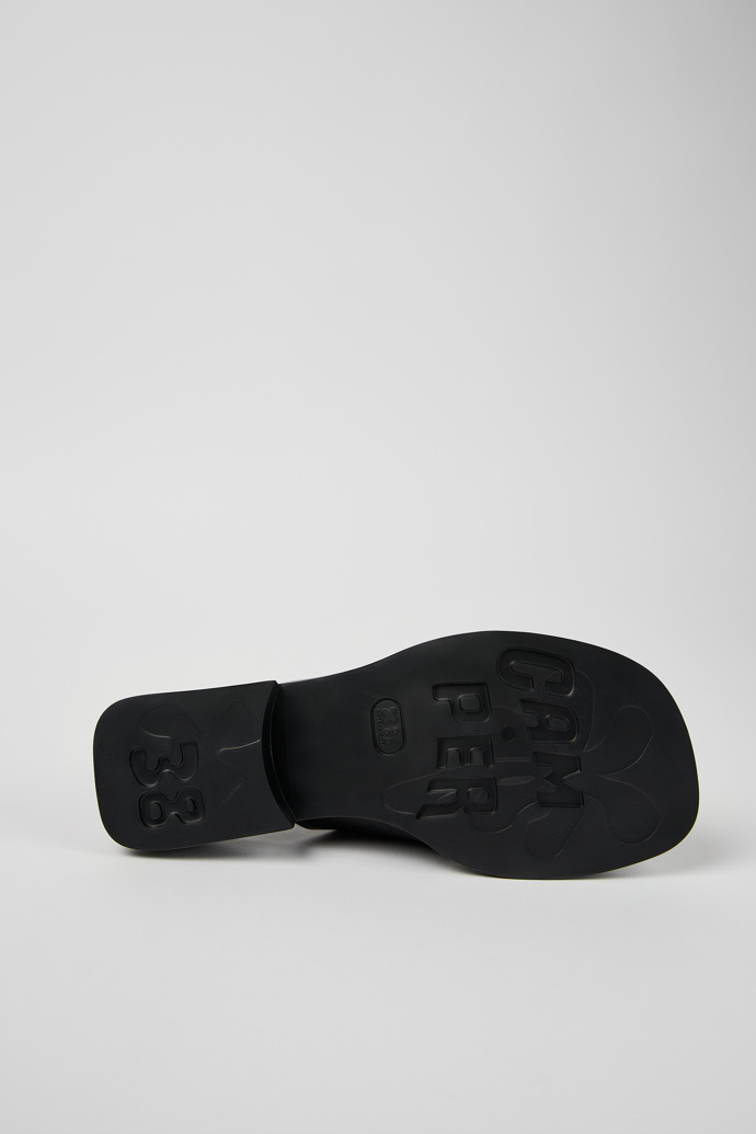 The soles of Dana Black Leather Cross-strap Sandal for Women