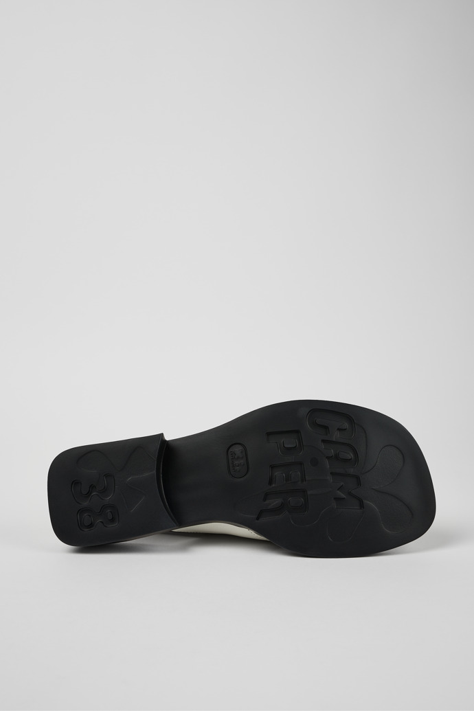The soles of Dana White Leather Cross-strap Sandal for Women